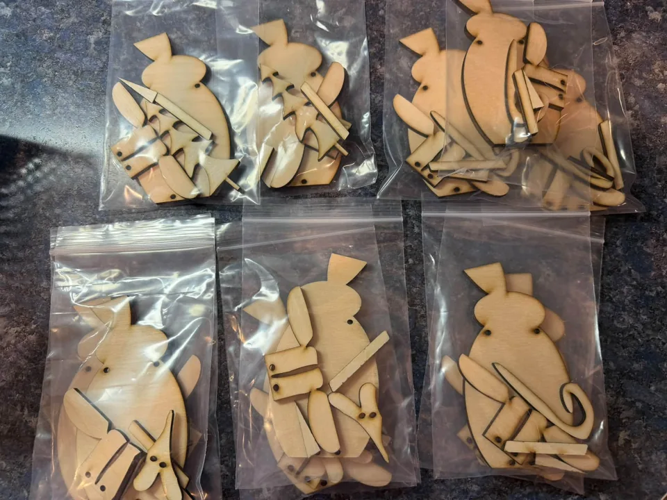 Collection of packaged wooden winter craft designs