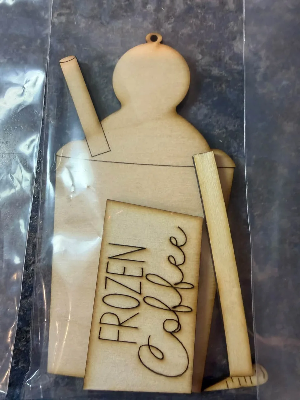 Wooden snowman with Frozen Cafe lettering