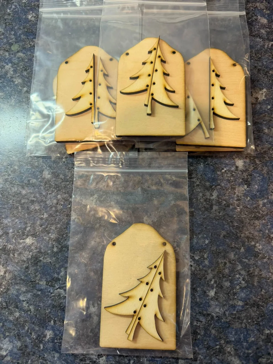 Wooden snowman and tree ornament designs
