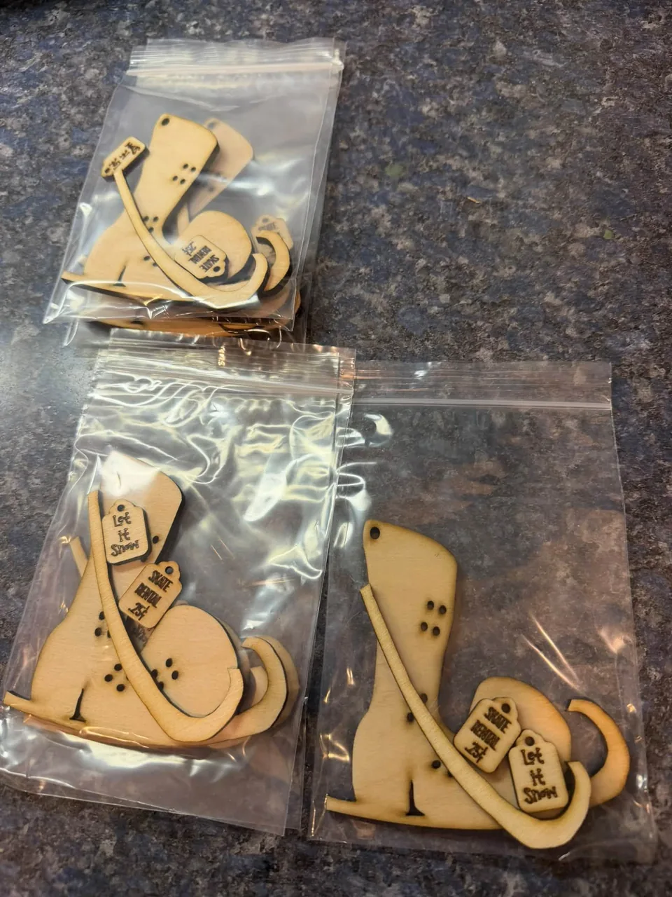 Packaged wooden snowman and sleigh craft designs