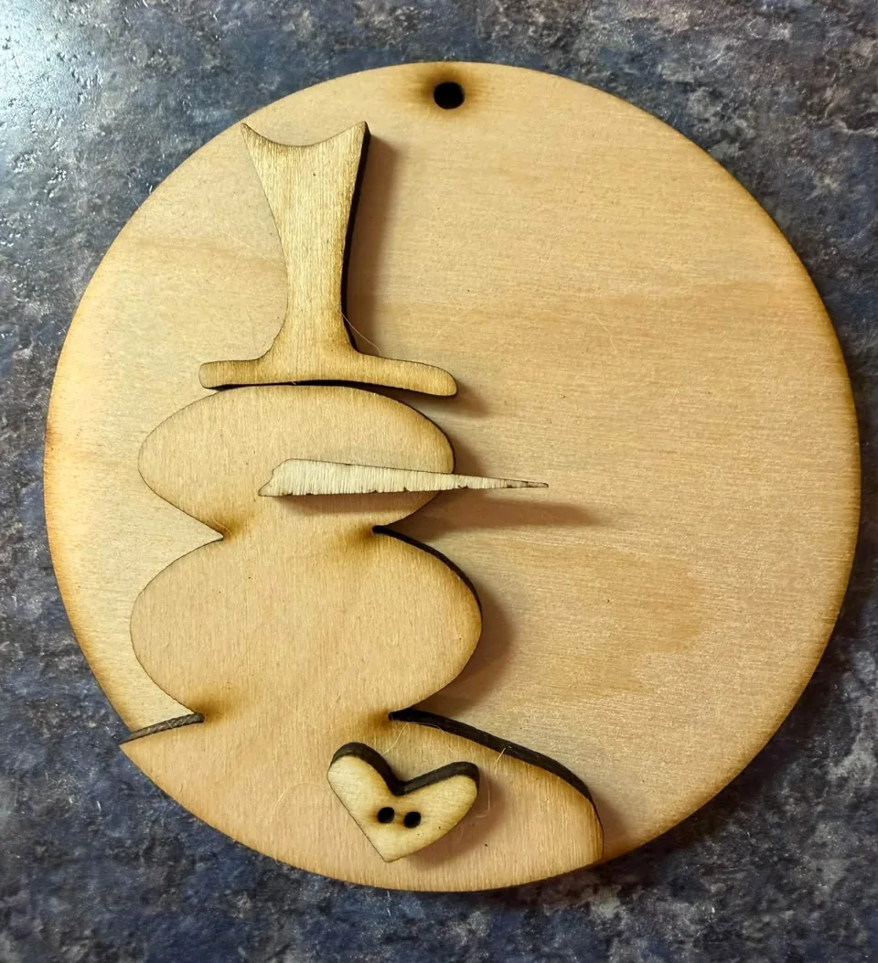 Round wooden snowman ornament with top hat